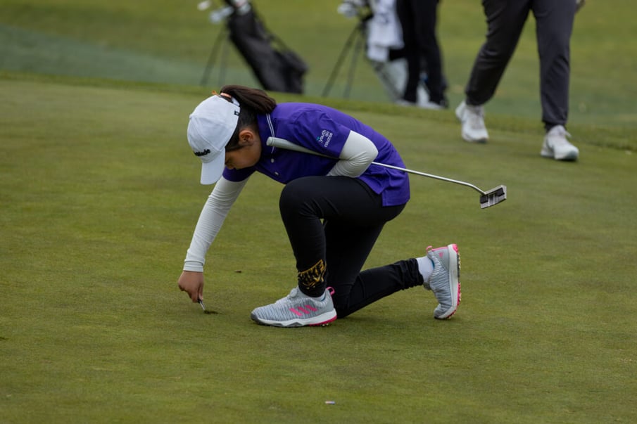 Youth on Course member picking up her tee