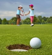 Two young junior golfers enjoying a round of golf
