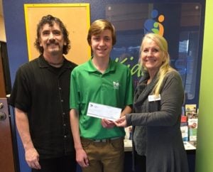 YOCLC member Brayden visits Kids First to present them with the YOCLC Grant with Mike Mason and Barbara Besana