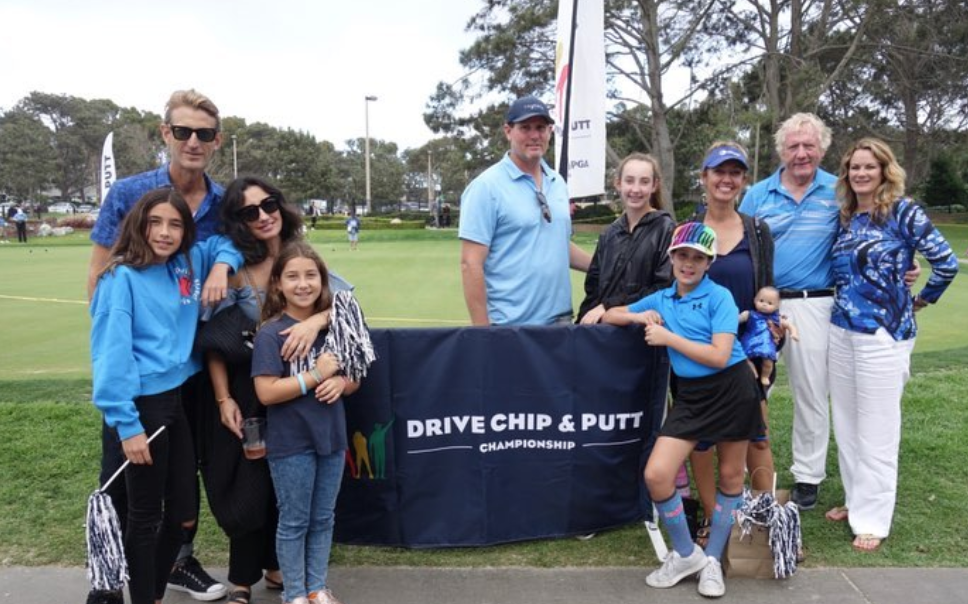 Youth on Course member Milan Norton with family and supporters at the Drive, Chip,  & Putt Championship