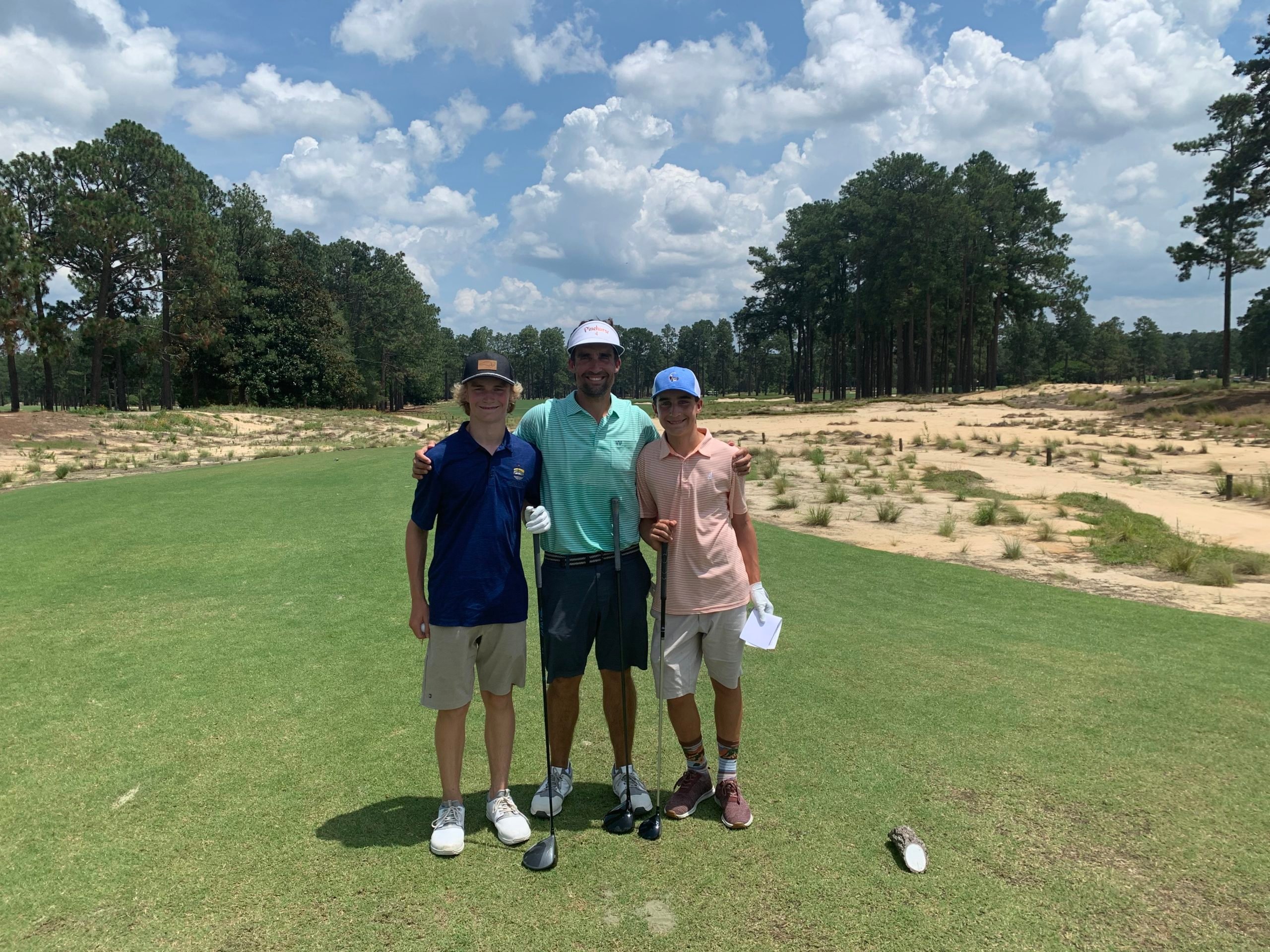 Nate Carr with his two sons (Youth on Course members) enjoying a round of golf