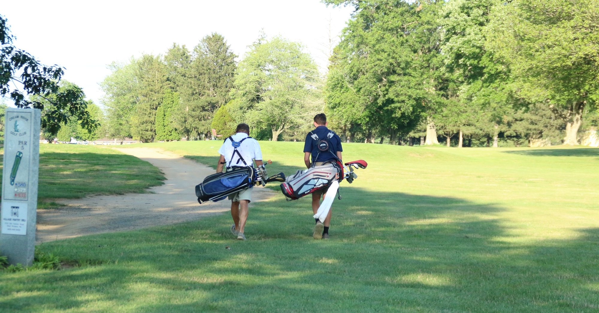 Two youth on the golf course.